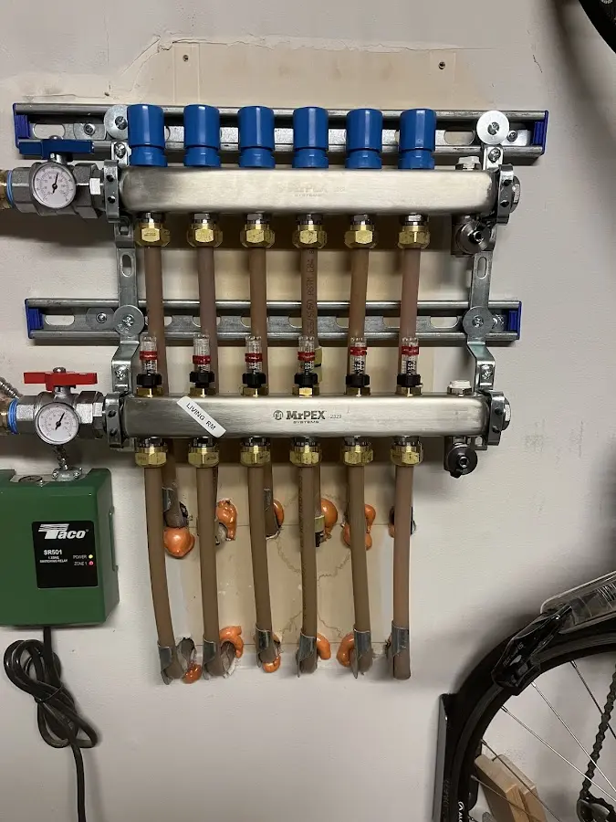 Plumber performing Water Heater Repair at a residential property in Phelps